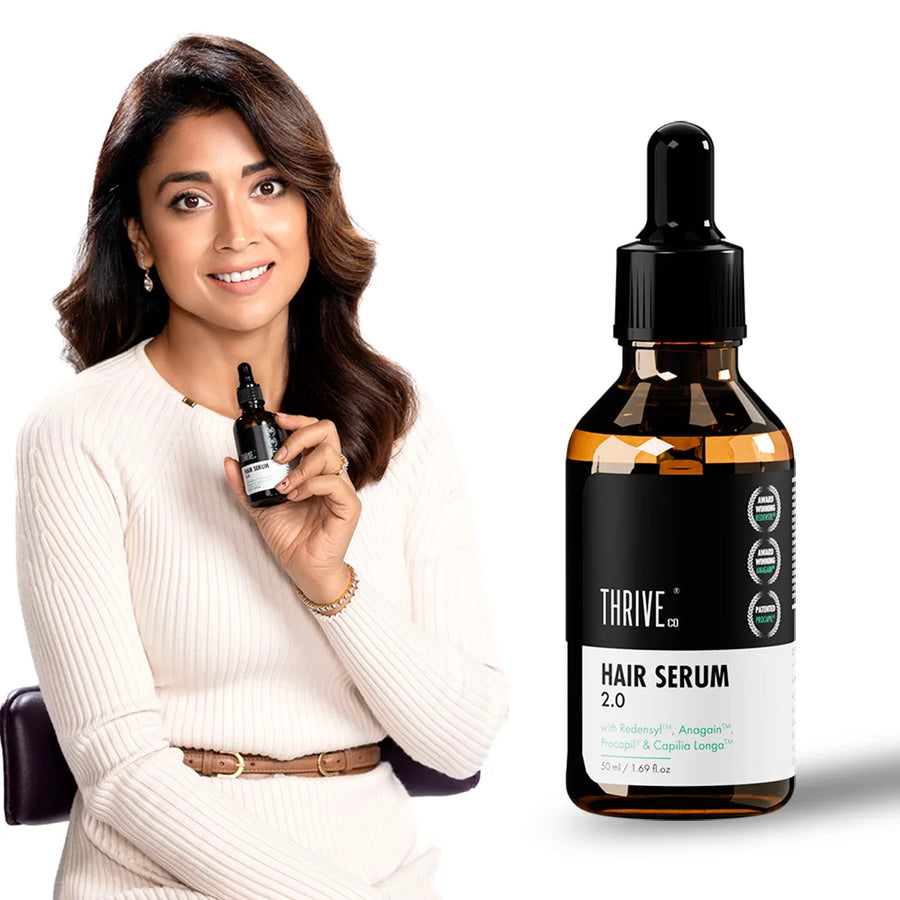 Shriya Saran holding a bottle of Thrive Co Hair Prime Serum. Next to her is a larger image of the Thrive Co. Hair Serum 2.0 bottle.