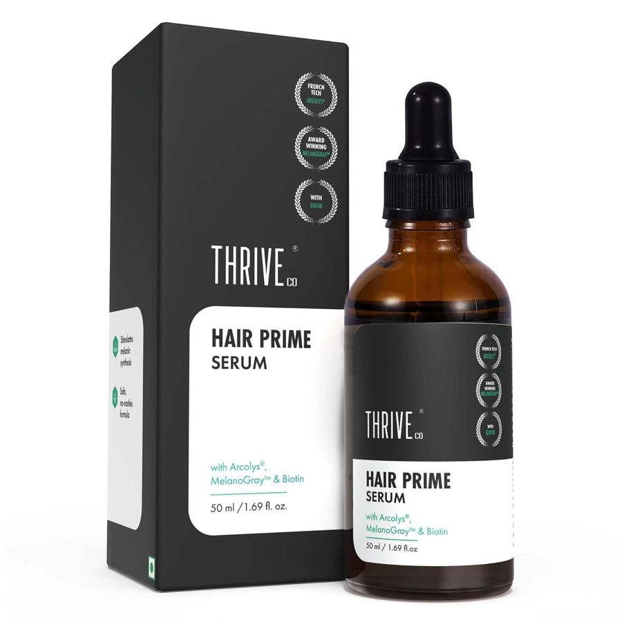 A bottle of Thrive Co. Hair Prime Serum with key ingredients like Arcolis, Melanogray, and Biotin.
